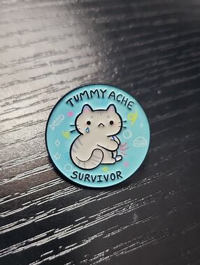 Tummy Ache Survivor Cat Enamel Brooch - Blue